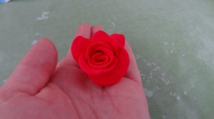 The clay rose easily fit in my hand since it was smaller than my middle finger